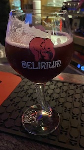 A cup of Delirium Red beer